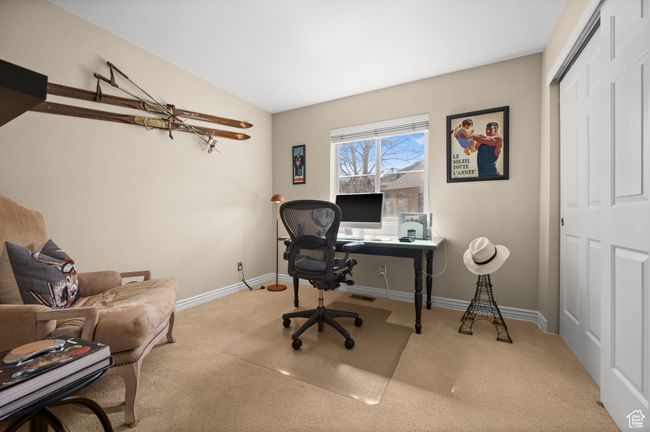 Main floor bedroom with light carpet | Image 14