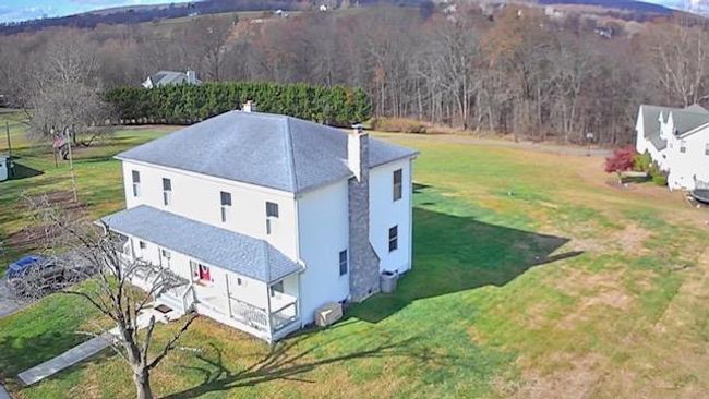 Drone / aerial view featuring a view of trees | Image 4
