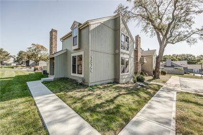 View of side of property with a lawn | Image 2