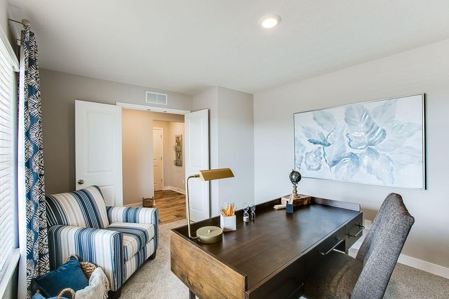 Close the double doors for privacy and quiet while working from home. Photos of model home. Colors and options may vary. Ask Sales Agent for details. | Image 14