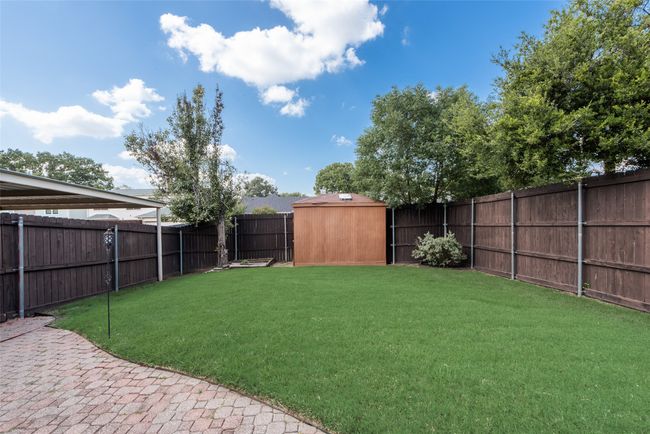 View of fenced backyard | Image 24