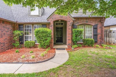 This full brick home with new interior paint and new carpet sits on a quiet street in a great Jenks neighborhood . | Image 2