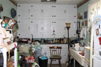 kitchen with farmhouse style sink and tons of storage | Image 3