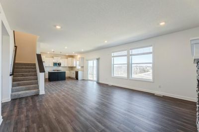 (Photo of an inventory home, actual homes finishes will vary) Soaked in natural sunlight, the homes eat-in dining room has plenty of space for a dining room table. | Image 3