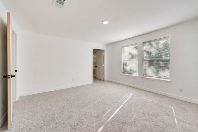 Empty room with recessed lighting, baseboards, visible vents, and carpet | Image 16