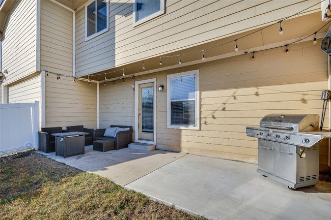 View of patio featuring a grill and outdoor lounge area | Image 18