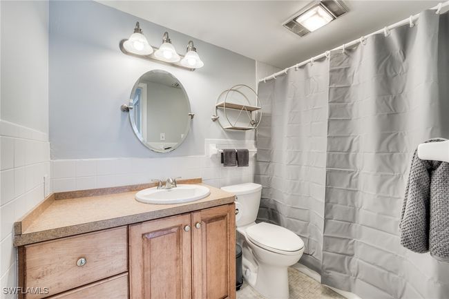 Owner's ensuite full bath featuring vanity with generous countertop and storage space plus full size linen closet. | Image 9