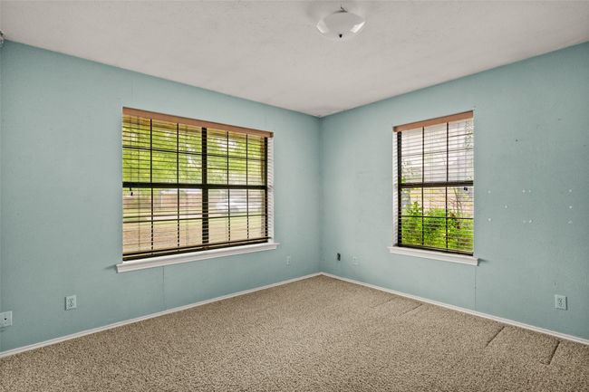 Carpeted empty room featuring baseboards and plenty of natural light | Image 20
