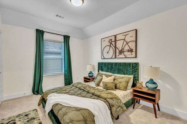 Carpeted bedroom with beautiful ceiling lines. | Image 29