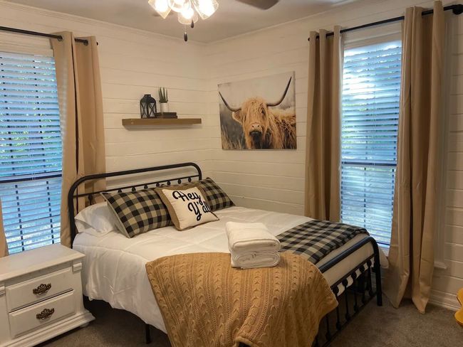 Bedroom featuring carpet flooring, multiple windows, ceiling fan, and crown molding | Image 15