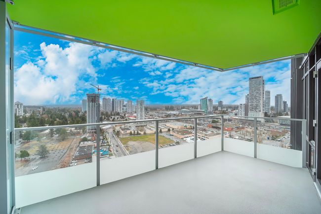 Balcony with a view of city and visible vents | Image 20