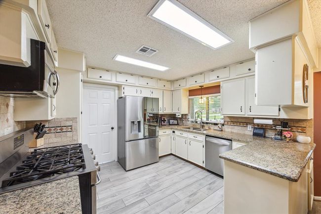 Kitchen w/fresh paint and gorgeous new appliances. | Image 10