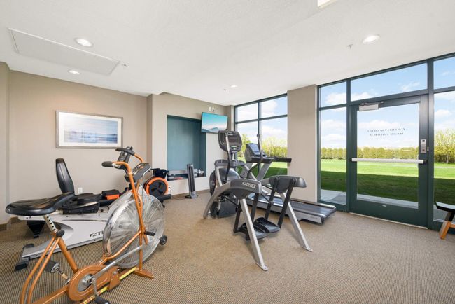 The first floor exercise room with a view of the Dakota Rail Trail. | Image 24