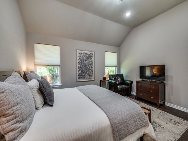 Bedroom with vaulted ceiling, baseboards, dark wood-style flooring, and recessed lighting | Image 18