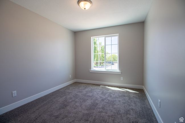 Carpeted spare room featuring baseboards. *Photo in picture is similar to the home being built | Image 8