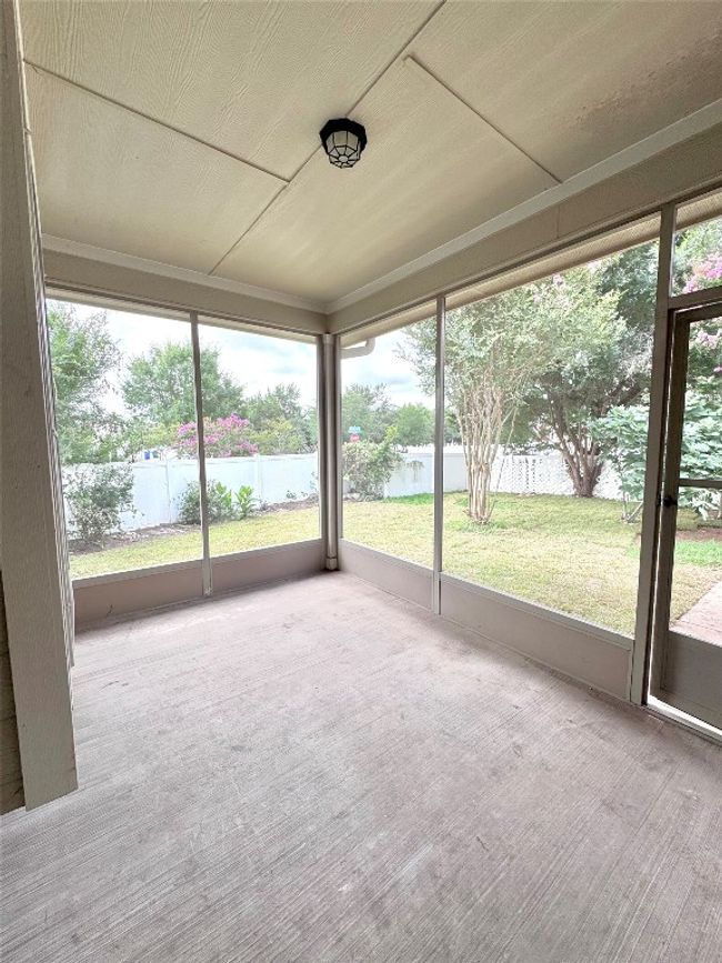 Unfurnished sunroom with a water view | Image 35