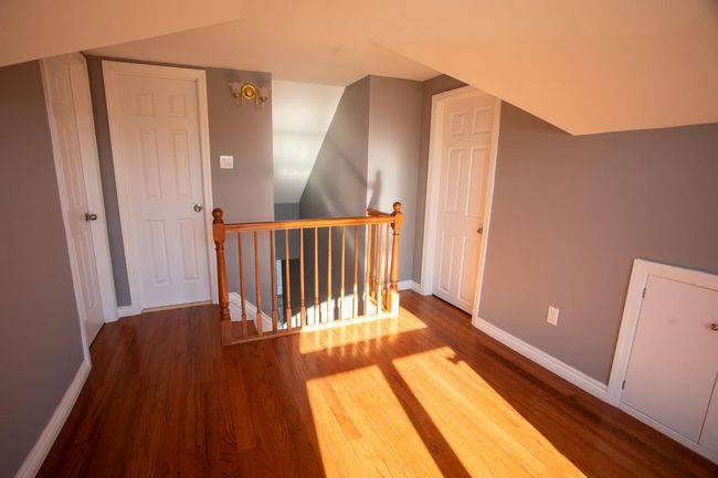 Additional living space featuring hardwood / wood-style floors | Image 19
