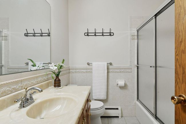 Sliding glass shower doors are convenient for your Guests. This condo features TWO bathrooms. | Image 27