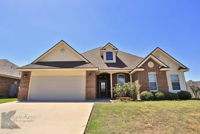 View of front of property featuring a garage and a front lawn | Image 3