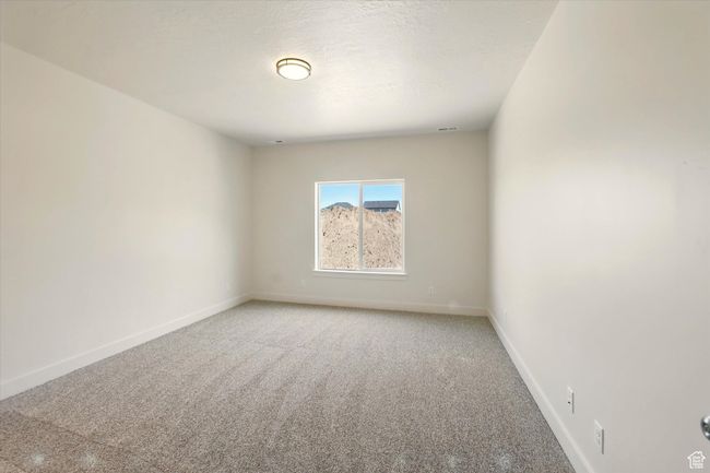 Unfurnished room with light colored carpet and baseboards | Image 15