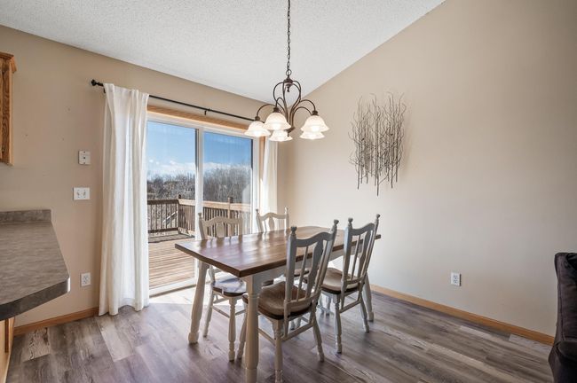 Kitchen and dining room have new plank flooring--just installed in 2025. | Image 10