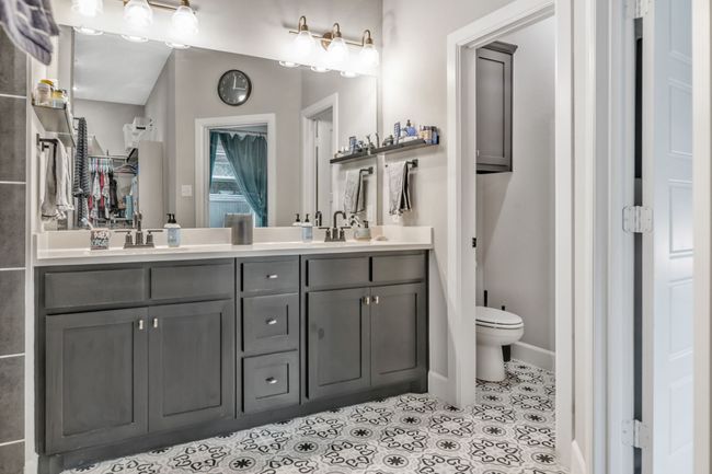 Full bath featuring double vanity and tile patterned flooring | Image 18