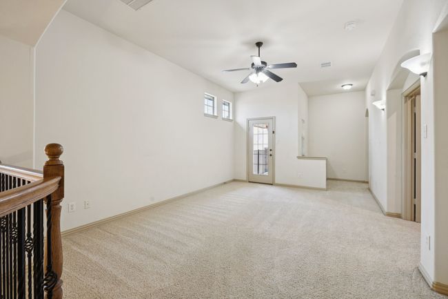 Unfurnished room with ceiling fan, carpet flooring, and baseboards | Image 24