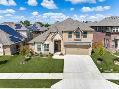 View of front of home featuring a garage and a front lawn | Image 2