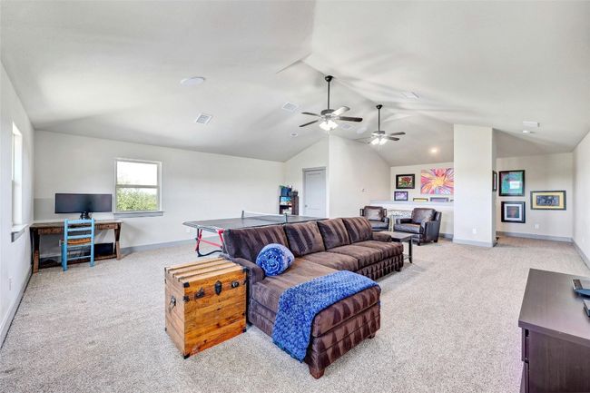 This secondary living space is the perfect spot for teens or guests to have some privacy. | Image 27