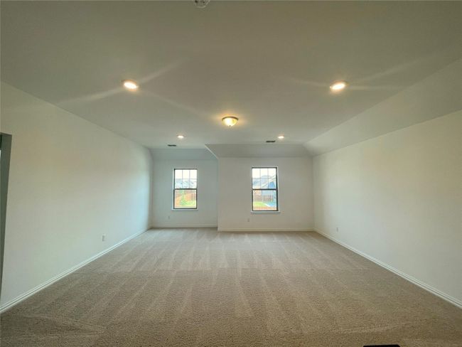 Spare room featuring recessed lighting, light carpet, and lofted ceiling | Image 17