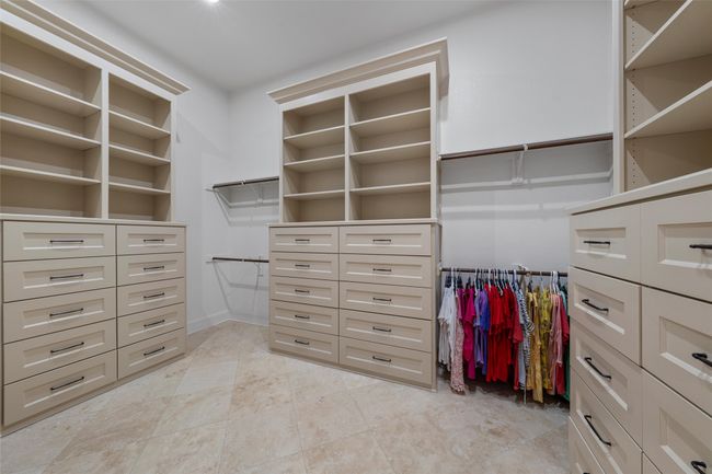View of walk in closet. | Image 18
