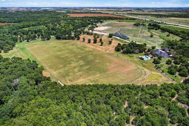 View of rural area with a heavily wooded area | Image 9