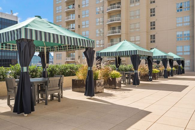 View of home's community with outdoor dining space, a gazebo, and a patio | Image 26