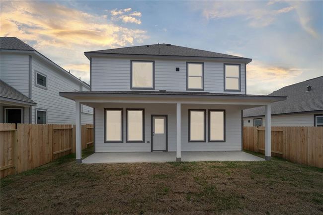 Come and see this spacious backyard with beautiful covered patio!! There is plenty of room for the kids to play and adults to relax! Perfect for your outdoor living space, patio furniture, bbq pit, and so much more! The possibilities are endless! | Image 14