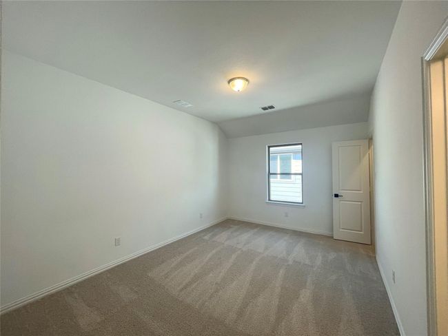 Empty room featuring light carpet and vaulted ceiling | Image 28