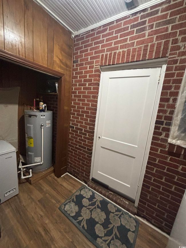 Utility room with electric water heater | Image 10
