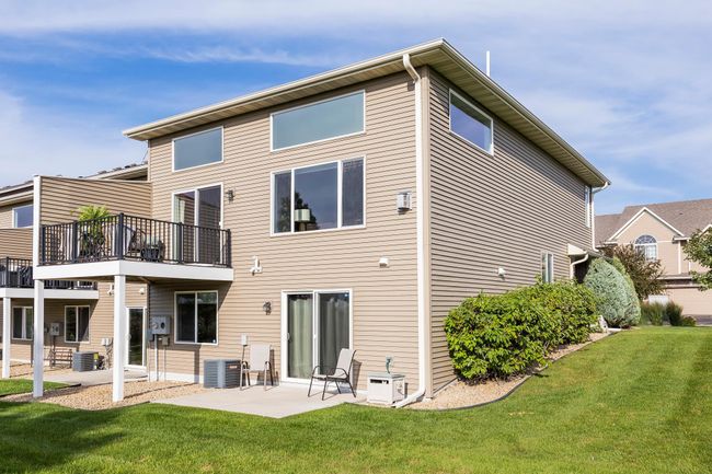 Back of home showing deck and patio. | Image 30