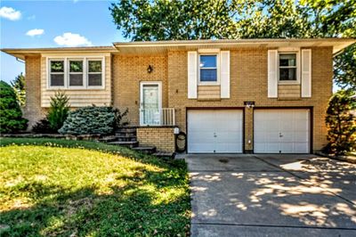 Split foyer home with a front yard and a garage | Image 3