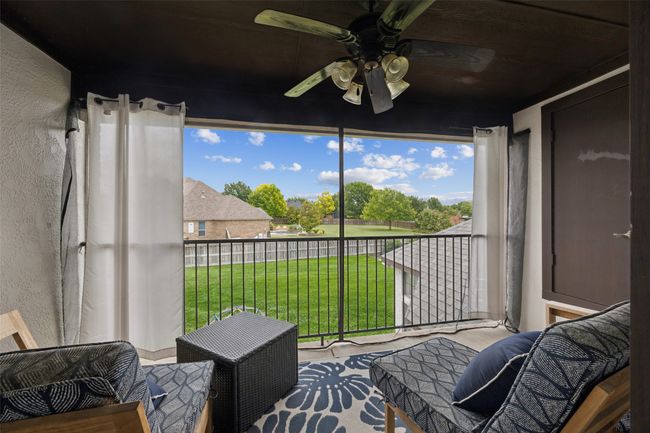 Sunroom / solarium featuring ceiling fan | Image 29