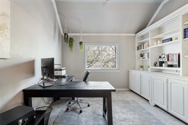 Office with light carpet, baseboards, and vaulted ceiling | Image 32
