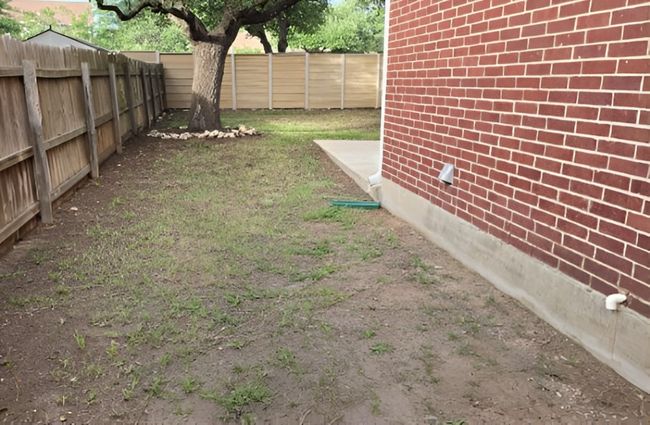 View of fenced backyard | Image 37