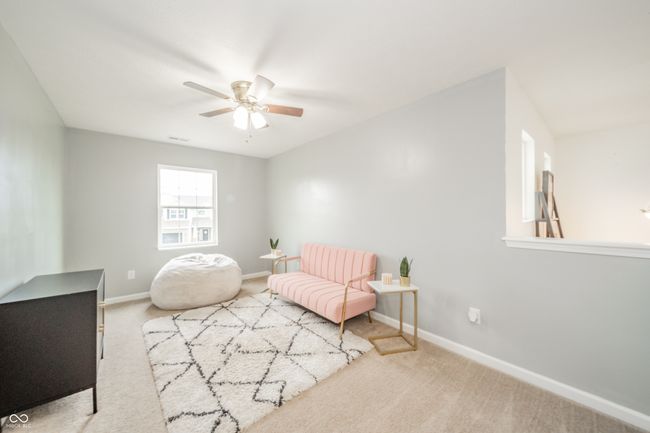 living area with ceiling fan, carpet flooring, and baseboards | Image 23
