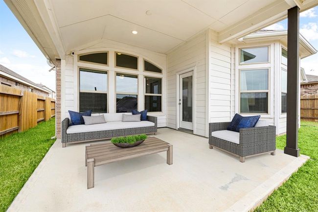 Come and see this spacious backyard with its beautiful covered patio and paved walkway down the side yard. There is plenty of room for the kids to play and adults to relax! Perfect for your outdoor living space, patio furniture, bbq pit, and so much more. The possibilities are endless! *Virtually Staged | Image 20