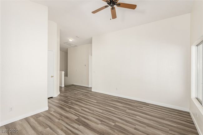 Living room with vaulted ceilings and lots of natural light | Image 8