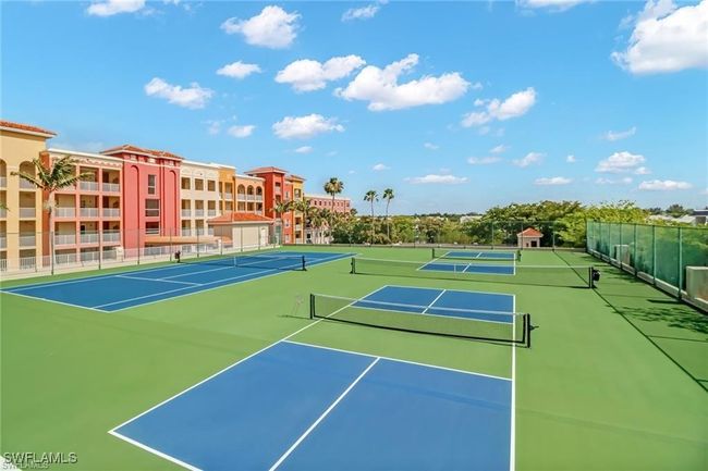 View of tennis court with community basketball court | Image 16