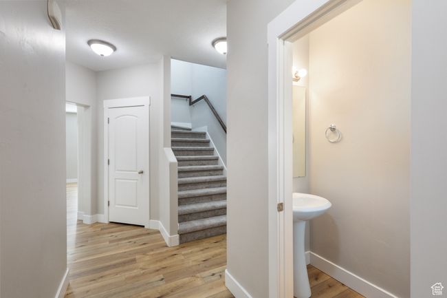 Stairs with wood finished floors and baseboards | Image 4