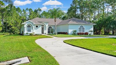 3064 Green Turtle Circle, House other with 4 bedrooms, 3 bathrooms and null parking in Mims FL | Image 3