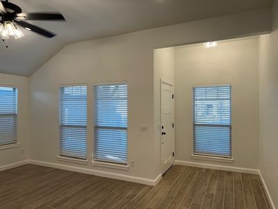 Entryway with ceiling fan, vaulted ceiling, and dark hardwood / wood-style flooring | Image 3