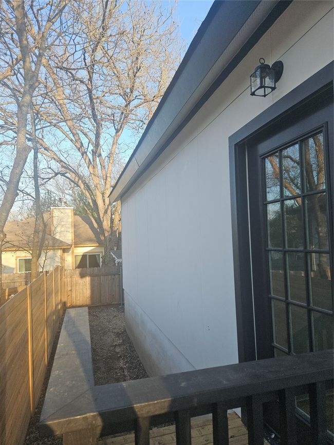 View of side of home featuring fence | Image 23