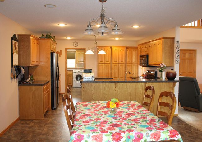 View from sunroom looking in to the kitchen. | Image 33